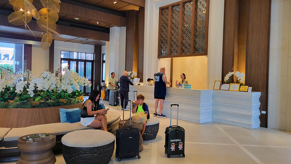 A Pattaya hotel security deposit being paid in a hotel lobby